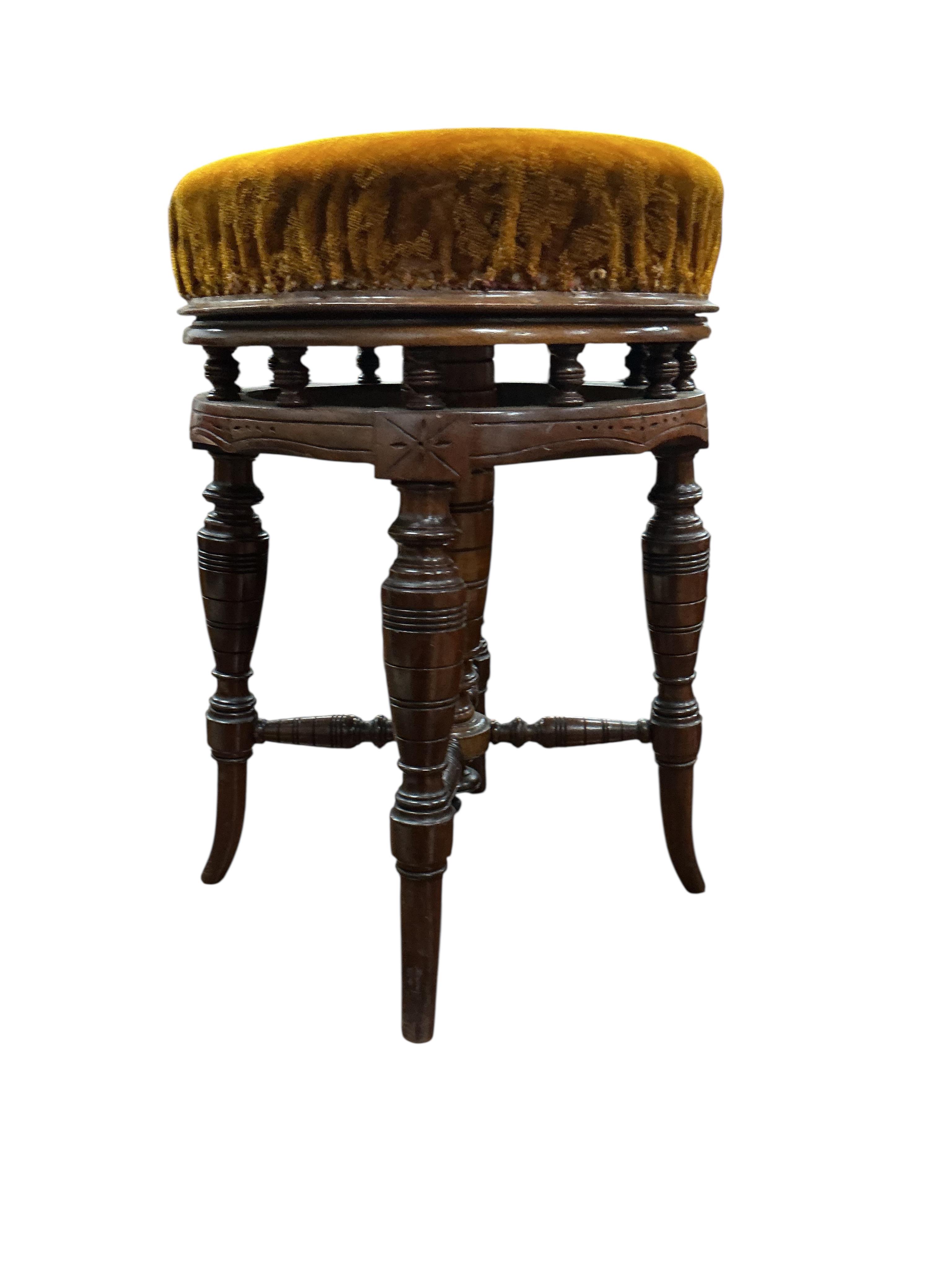 A late Victorian mahogany adjustable revolving piano stool